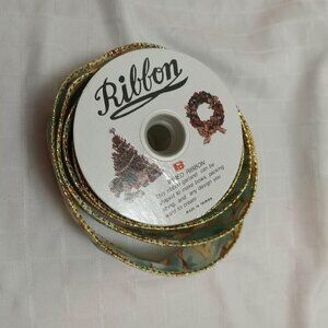 The remaining long length of a vintage ribbon roll with an angelic pattern